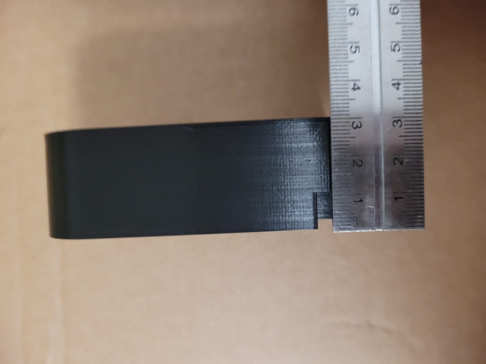 Figure 4 - Part brought by the client comparing measurements with a steel scale (detail c)